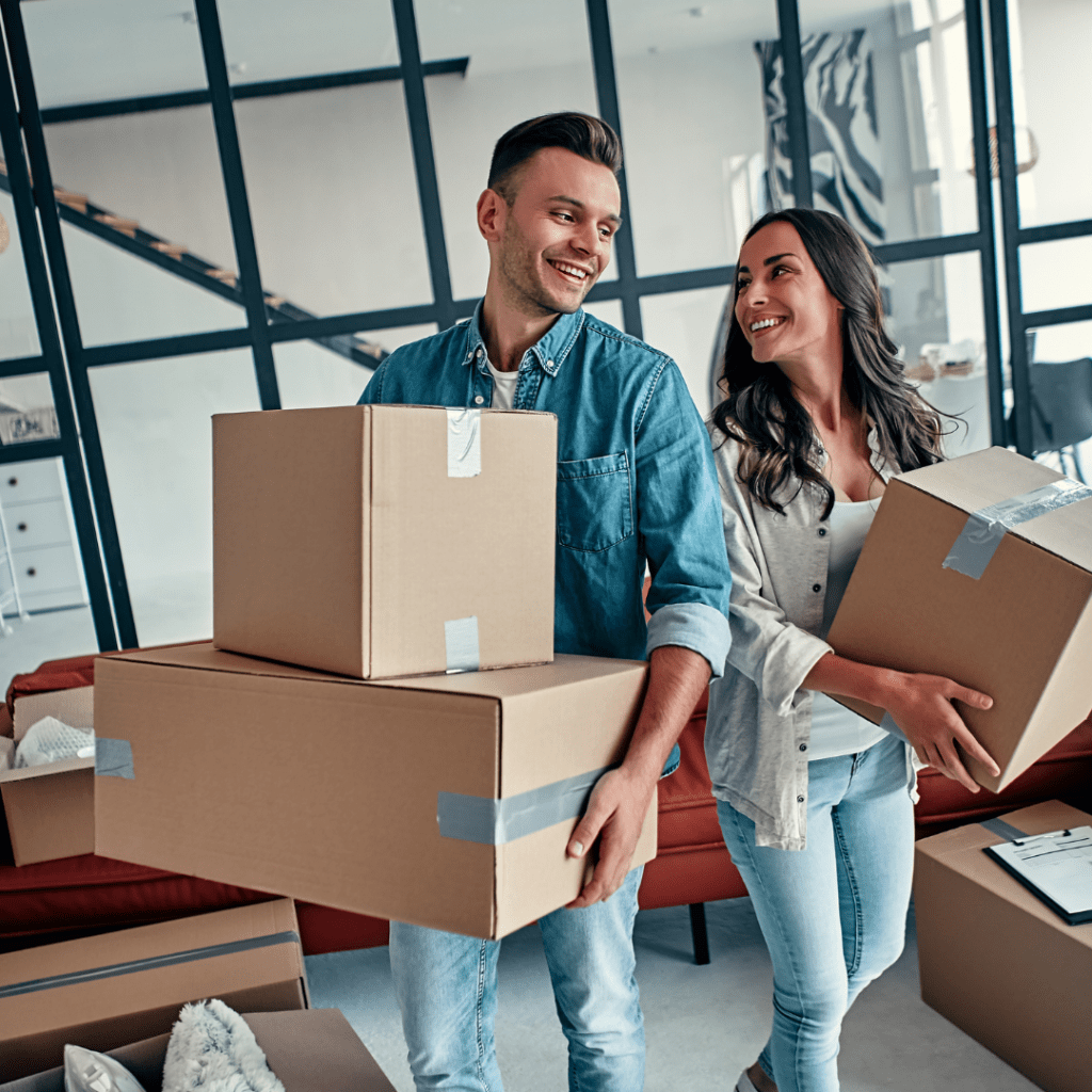 Happy couple moving to an apartment